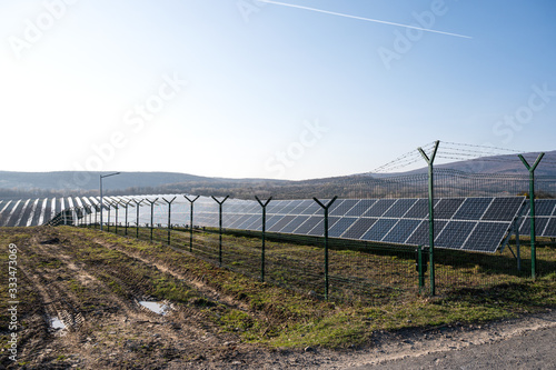 View of a solar energy station on a field.