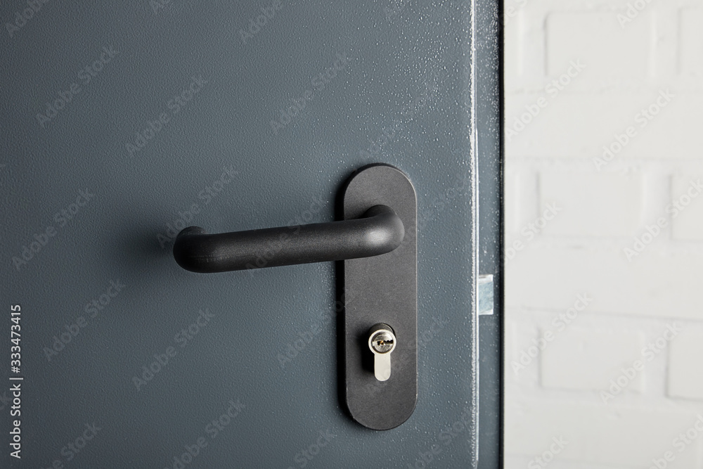 clean metal door with black handle after disinfection clean metal door with black handle after disinfection