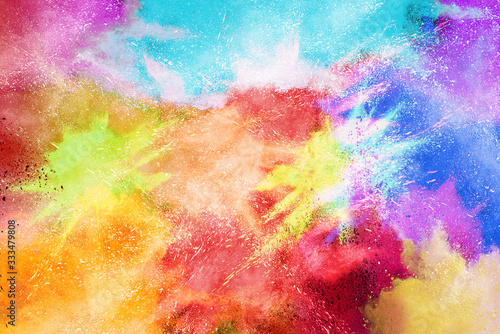 Explosion of colored powder isolated on white background. © piyaphong