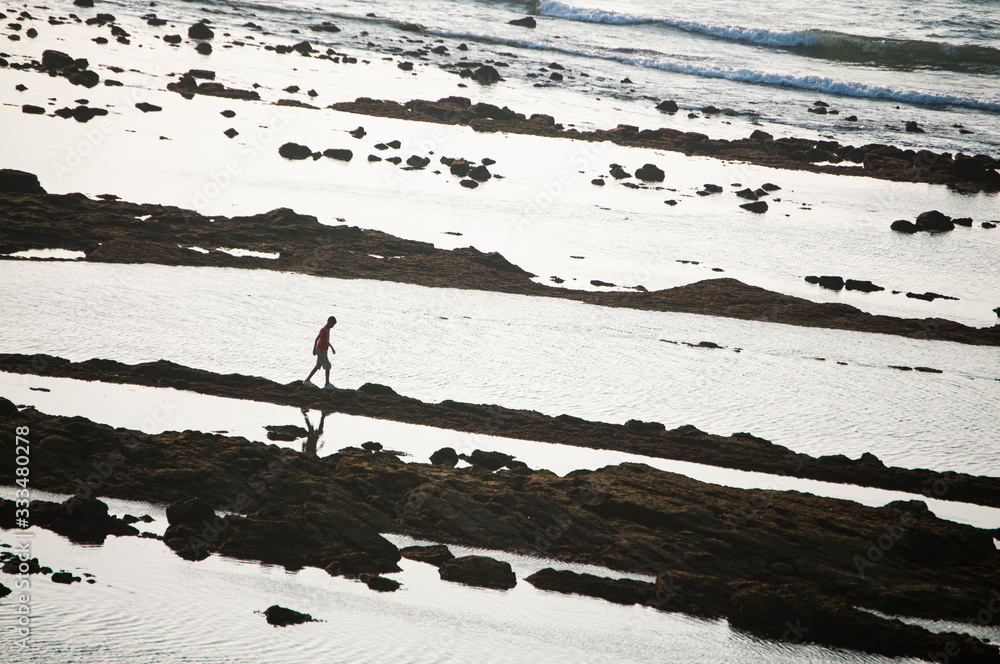 Person walking on the beach in morocco