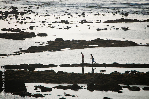 Obraz na płótnie Person walking on the beach in morocco w salonie