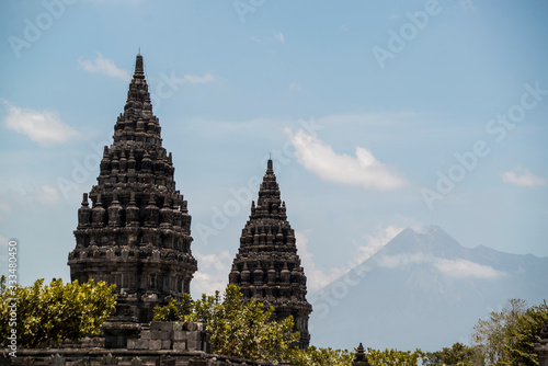 Prambanan Large Ancient  Buddhist Temple in Indonesia with Volcano