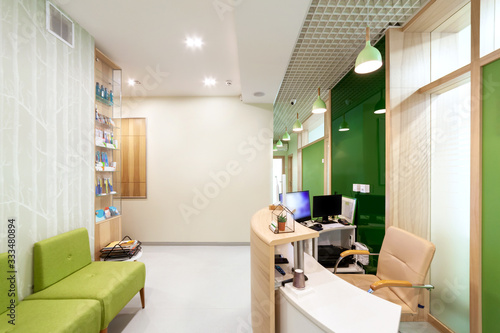 Lobby entrance with reception desk in a dental clinic. © Dmytro Panchenko
