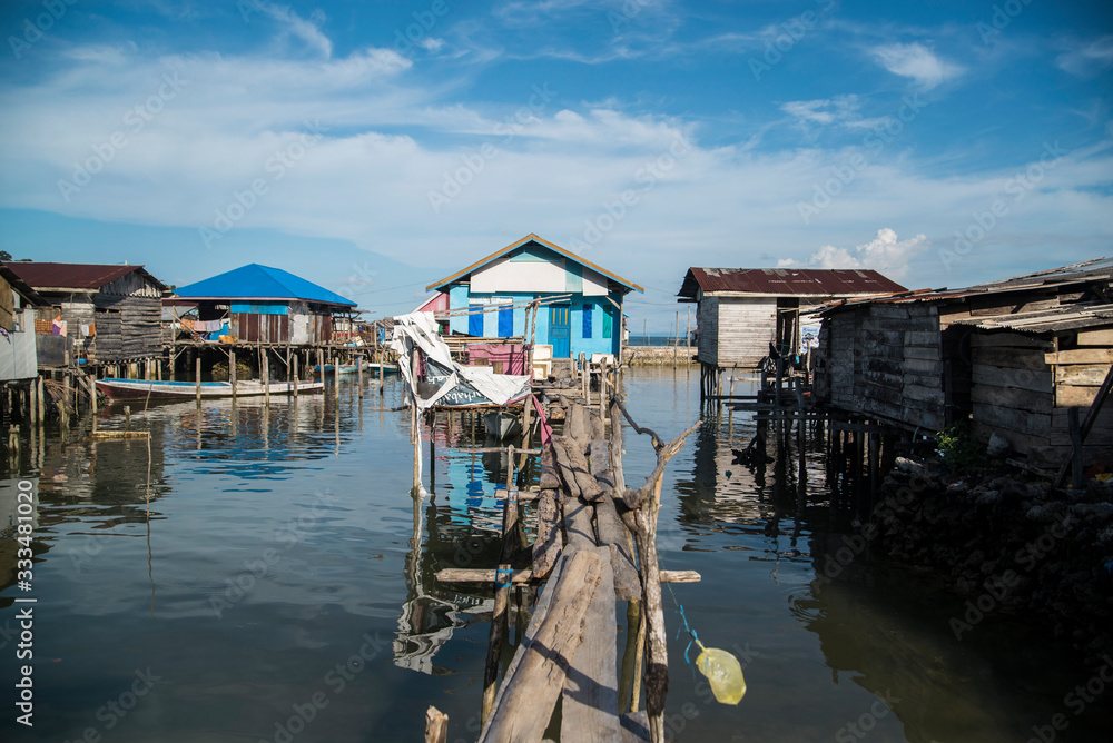 Stilt Village House over Ocean in Indonesia