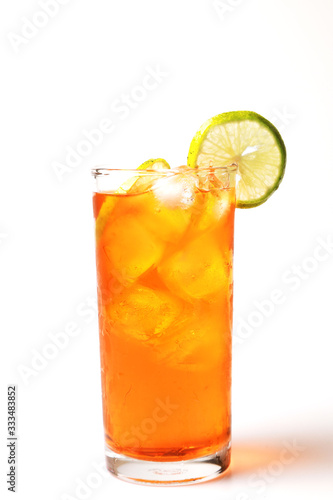 Iced tea lemon juice fresh drink on white bakcground, Isolate black tea and lime lemon in the glass cocktail drink.