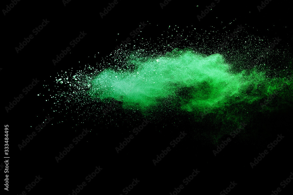Green powder explosion on black background. Green powder explosion on black background.