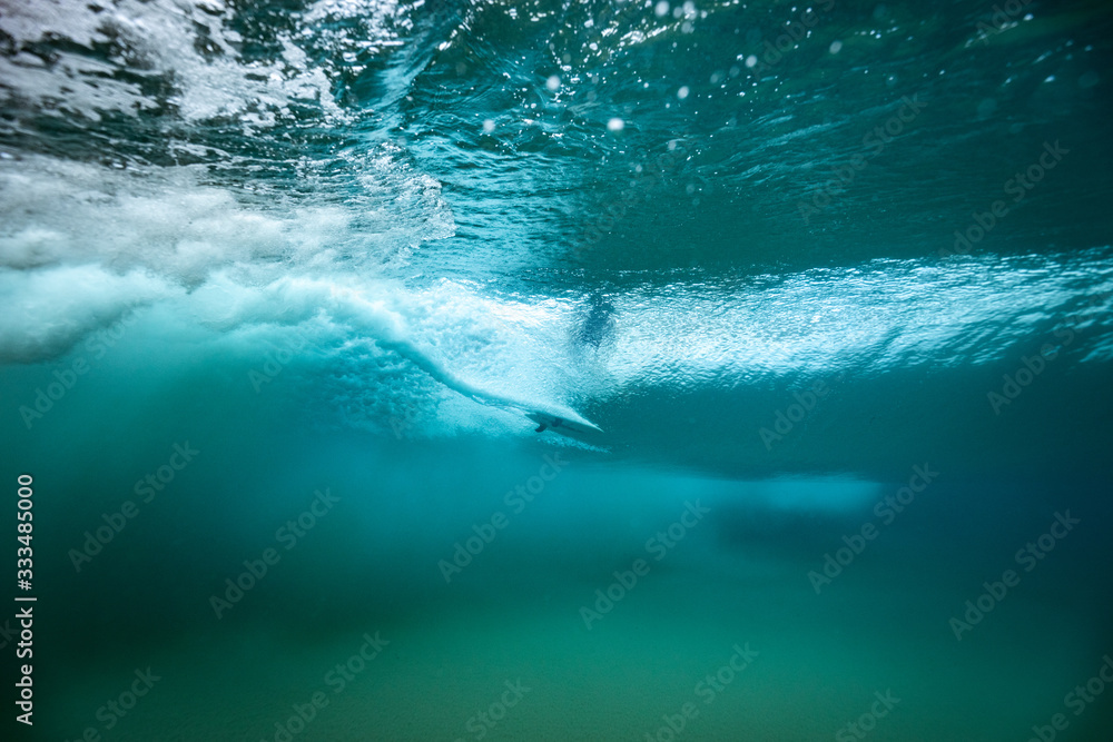 surfer on a wave from below