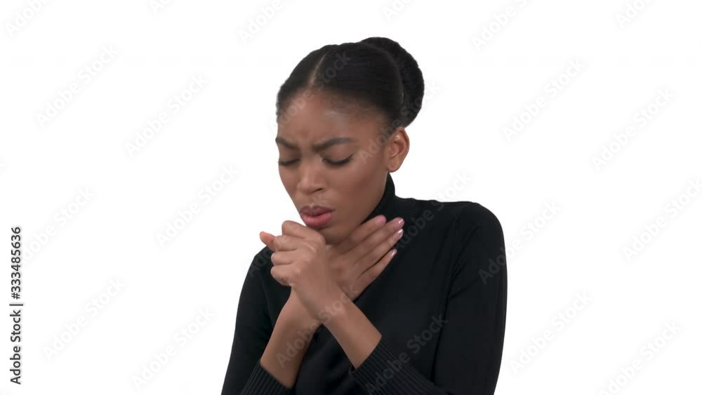 Side view of a young african woman in a black roll-neck polo touching her neck. Having a heavy dry cough. Isolated on the white background. Side view of a young african woman in a black roll-neck polo touching her neck. Having a heavy dry cough. Isolated on the white background.