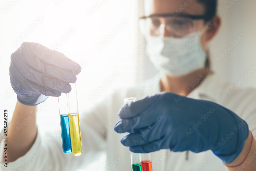 Medical staff checking test tubes in laboratory. Medical tests, fighting coronavirus covid19 Medical staff checking test tubes in laboratory. Medical tests, fighting coronavirus covid19