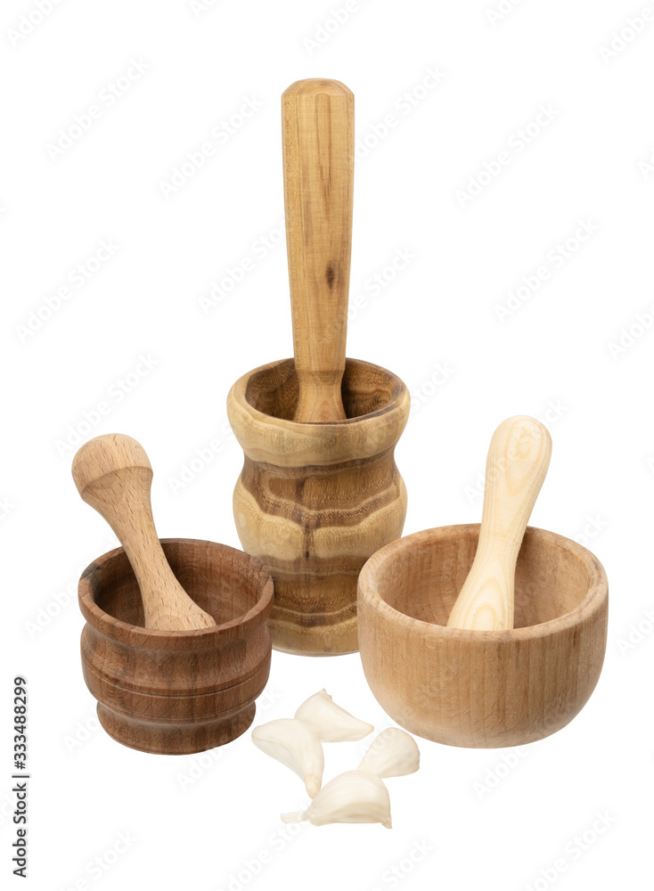 three handmade wooden mortars on a white background