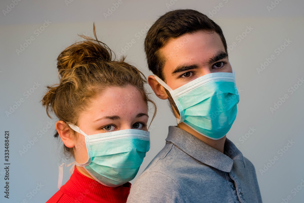 young couple wearing protective masks