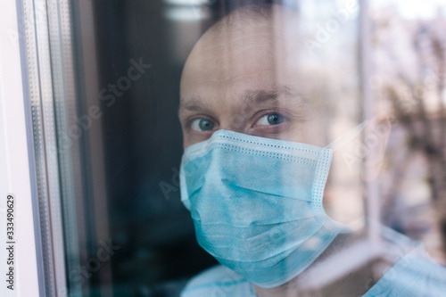 Portrait of a man in surgical mask. Stop epidemic. Epidemic infection. Stop coronavirus. Quarantine. Stay home. 