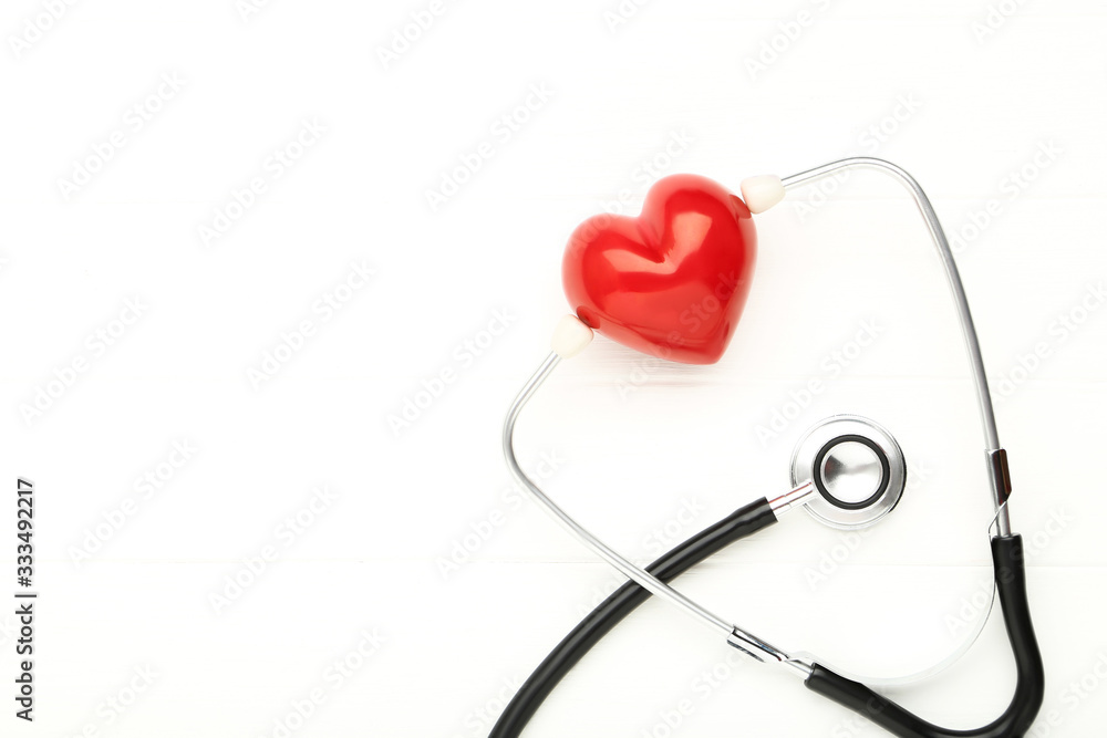 Stethoscope with red heart on white background Stethoscope with red heart on white background