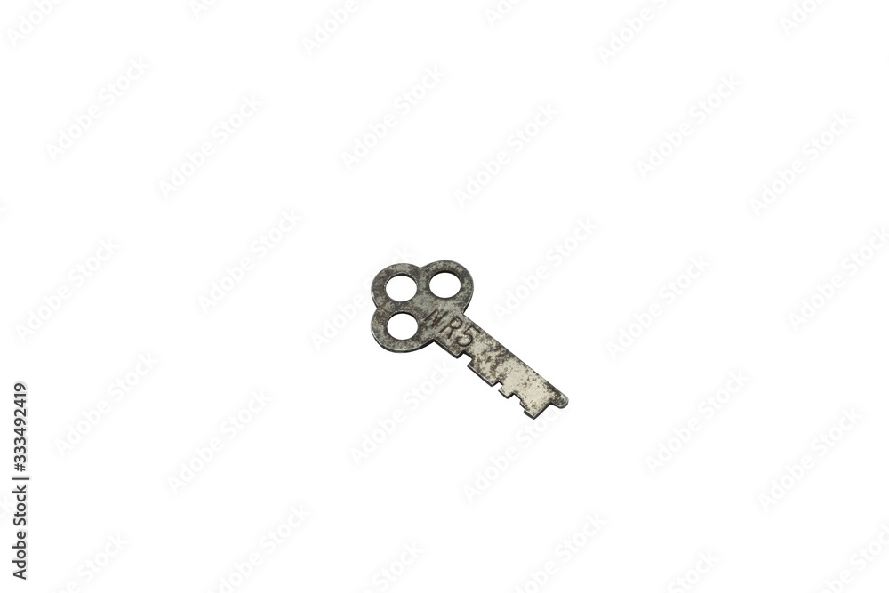 A rusted, old safe deposit box key, close up, isolated on a clean, white background. Shot in macro. A rusted, old safe deposit box key, close up, isolated on a clean, white background. Shot in macro.