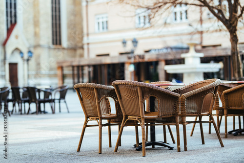 Empty seats of city cafe closed due COVID-19 pandemic.