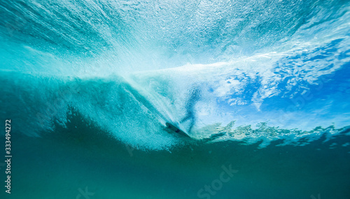 surfer on a wave from below photo