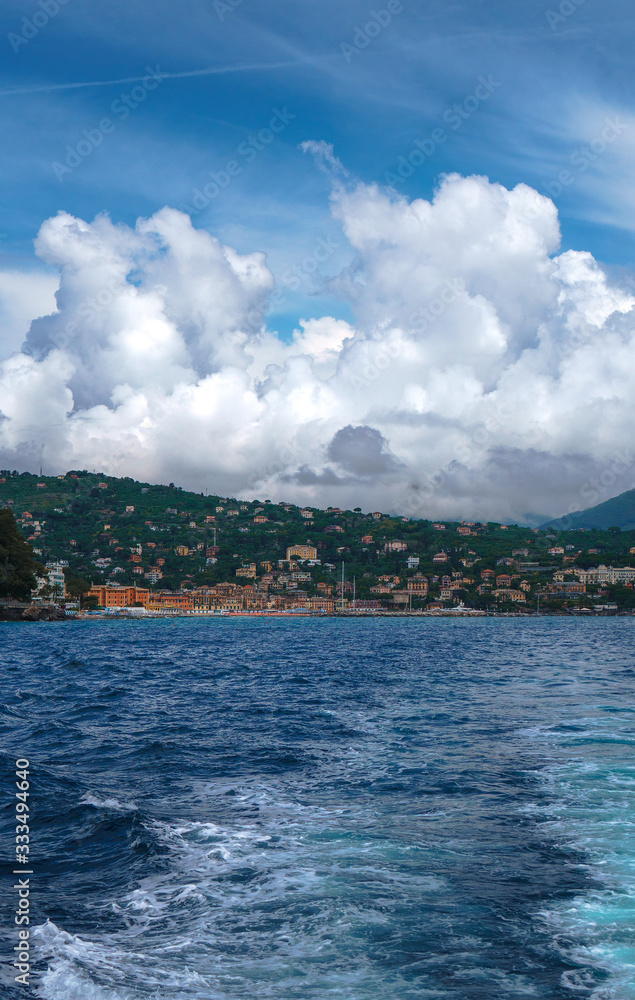 Scenic view of Santa Margherita Ligure on the Italian Riviera overlooking the Gulf of Tigullio. Beautiful mediterranean landscape with cloudy blue sky on sunny day.