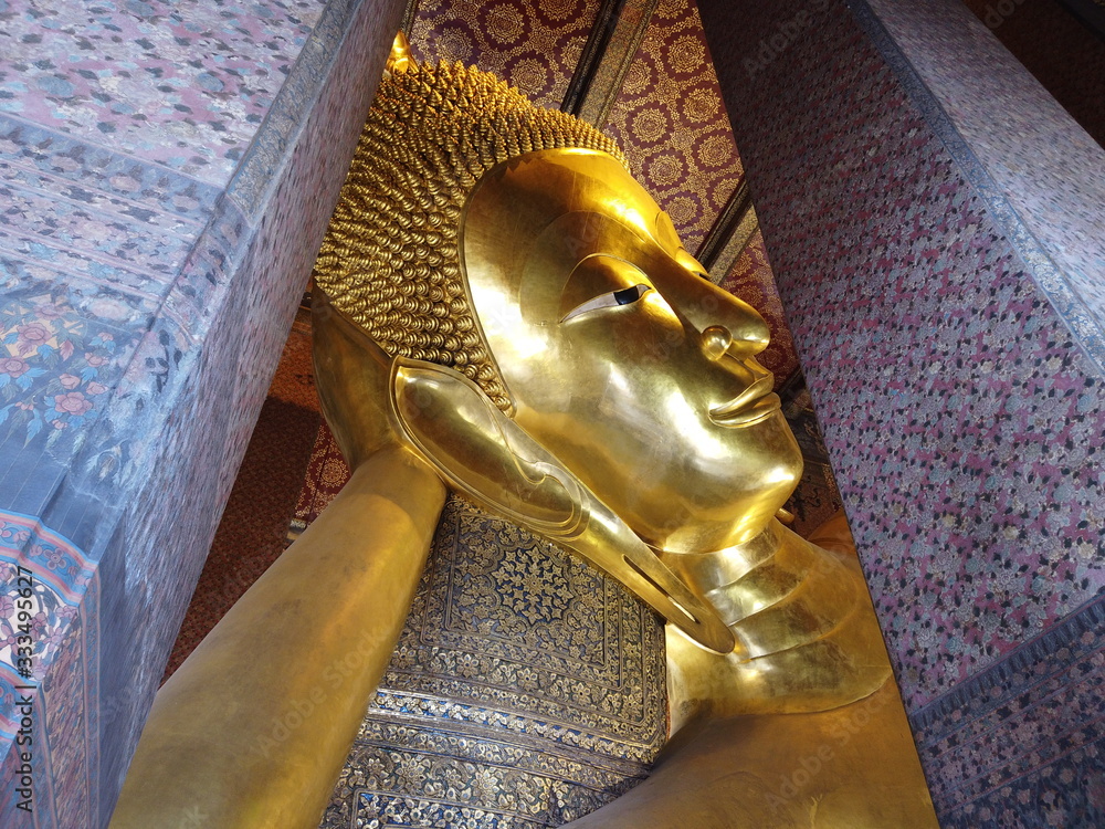 Golden statue of Buddha in Wat Pho, Bangkok Thailand