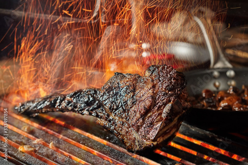 dry aged tomahawk on coal fire