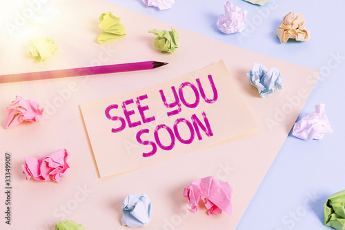 Handwriting text writing See You Soon. Conceptual photo used for saying goodbye to someone and going to meet again soon Colored crumpled papers empty reminder blue yellow background clothespin