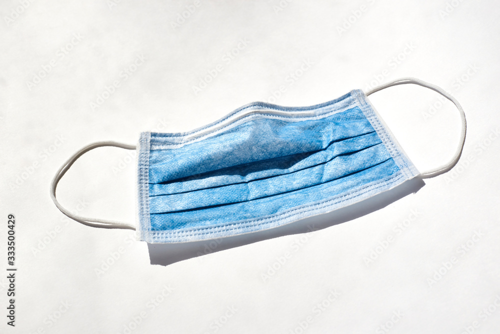 blue protective face mask against viruses on a white background blue protective face mask against viruses on a white background