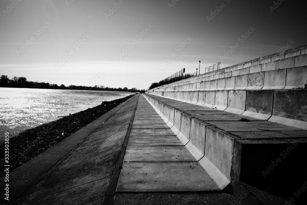 Landscape Quay on the river bank in the European city concrete stairs to relax people black and white photo