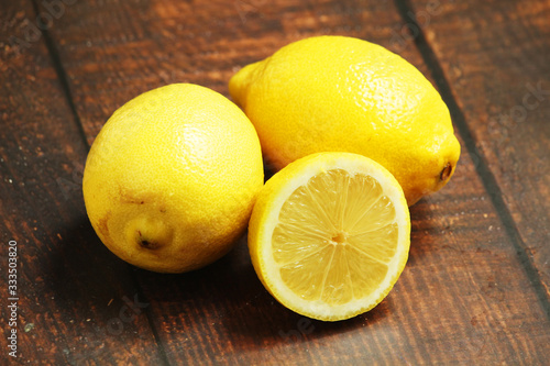 Lemons lying on the wooden rustic table