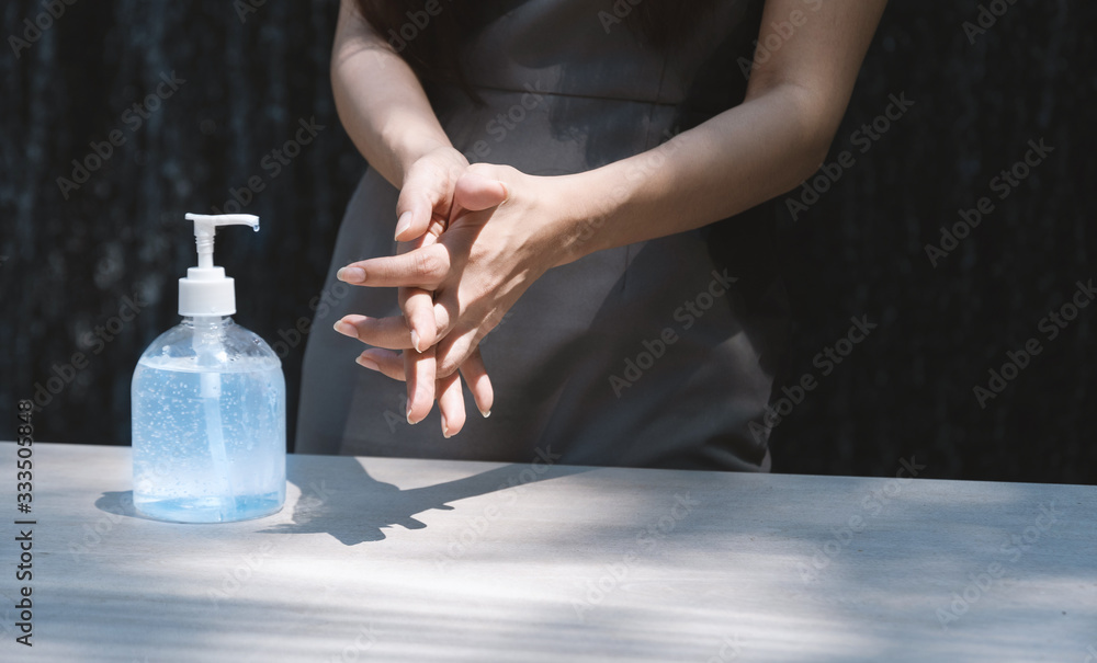 Young woman using alcohol gel sanitizer wash her hand for prevent infection coronavirus. Antibacteria concept. Hand sanitizer gel. Young woman using alcohol gel sanitizer wash her hand for prevent infection coronavirus. Antibacteria concept. Hand sanitizer gel.