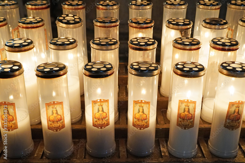Fototapeta premium Europe, Italy , Tuscany march 2020 candles to be lit in prayer in the church of Arezzo 