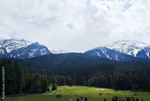 open field between mountains
