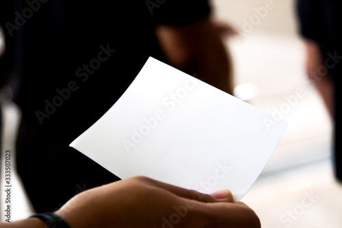 A man with a hand at a postcard with clipping path postcard