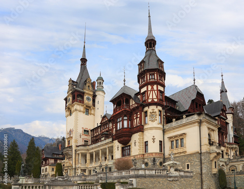 Famous Peles Castle and ornamental garden in Sinaia, Romania, landmark of Carpathian Mountains in Europe