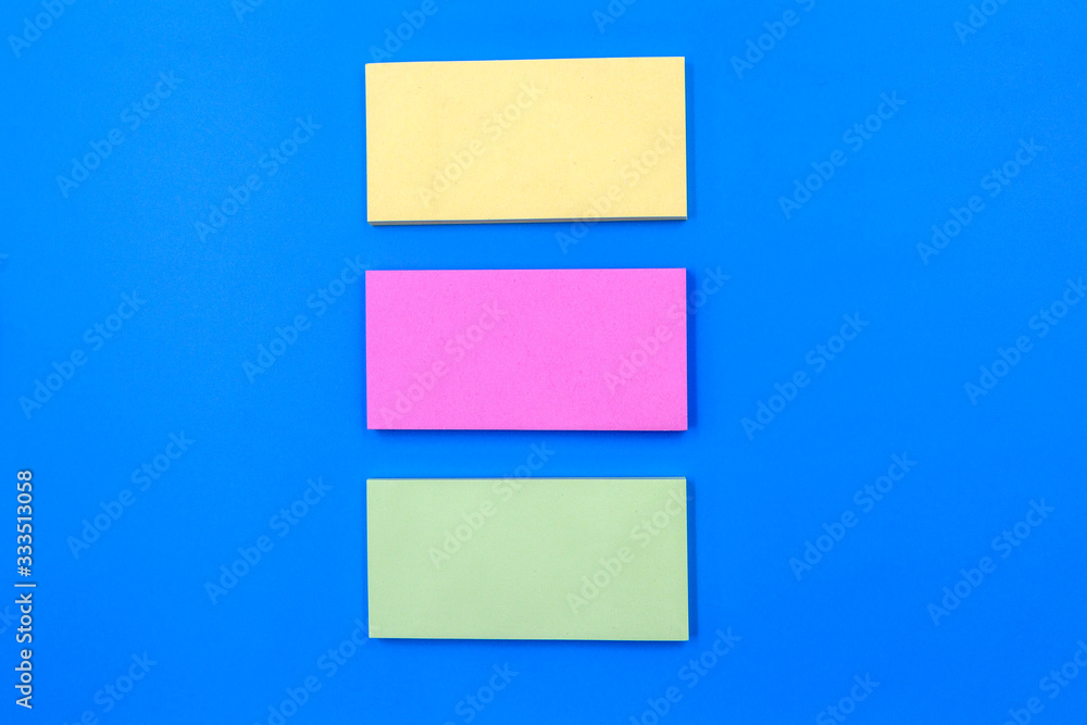 collection of colorful paper note on blue background collection of colorful paper note on blue background