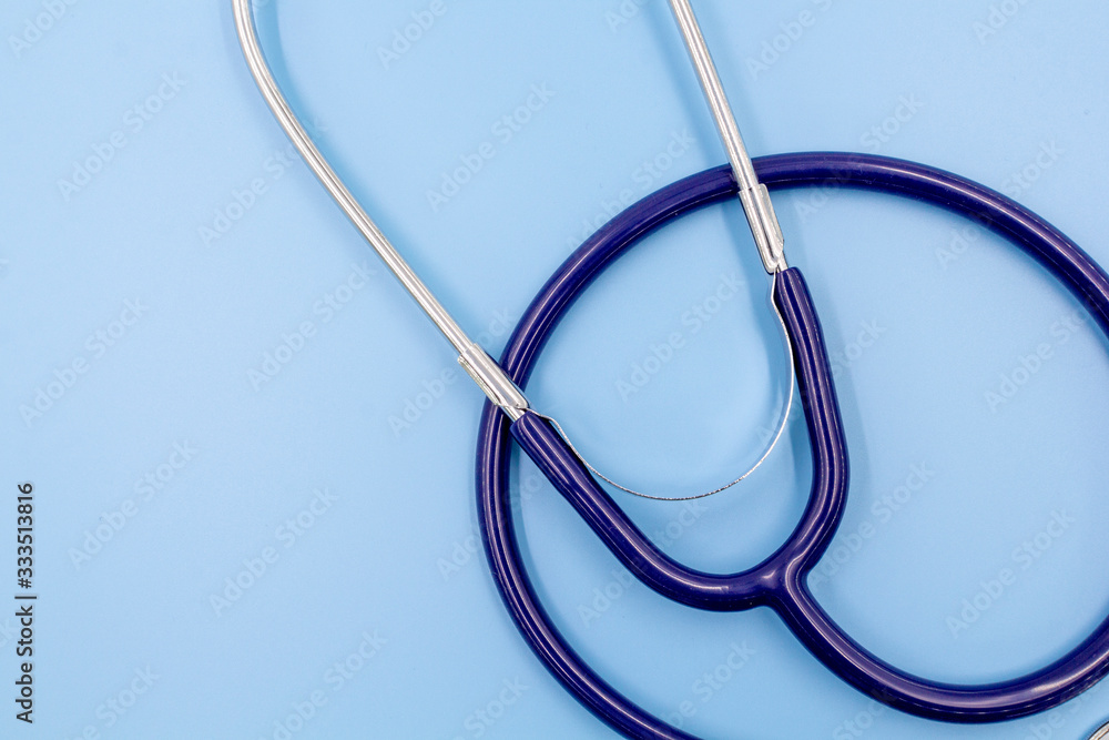 Separate medical stethoscope on a blue background with your text copy space. Health care concept Separate medical stethoscope on a blue background with your text copy space. Health care concept