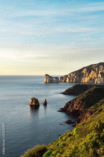 Iconic shot of Pan Di Zucchero at Sunset, beautiful travel location of Sulcis, Sardinia