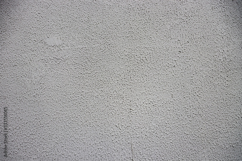 White-gray grungy wall background. gray-white surface