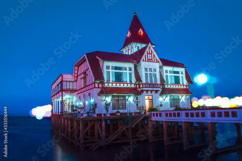 house on the shore on a lighted night