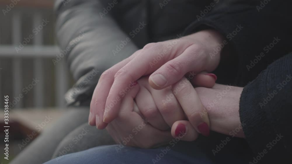 Close-up of male and female Caucasian hands holding each other. Young unrecognizable man and woman caressing palms. Concept of unity, love, romance, marriage. Close-up of male and female Caucasian hands holding each other. Young unrecognizable man and woman caressing palms. Concept of unity, love, romance, marriage.