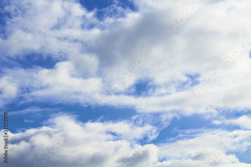 Beautiful blue sky and white large cumulus clouds. Close-up. Background. Scenery.