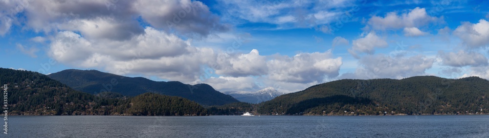 Panoramic View of Bowen Island during a sunny winter day with Ferry Leaving the Terminal. Taken at Horseshoe Bay, West Vancouver, British Columbia, Canada. Nature Background Panorama