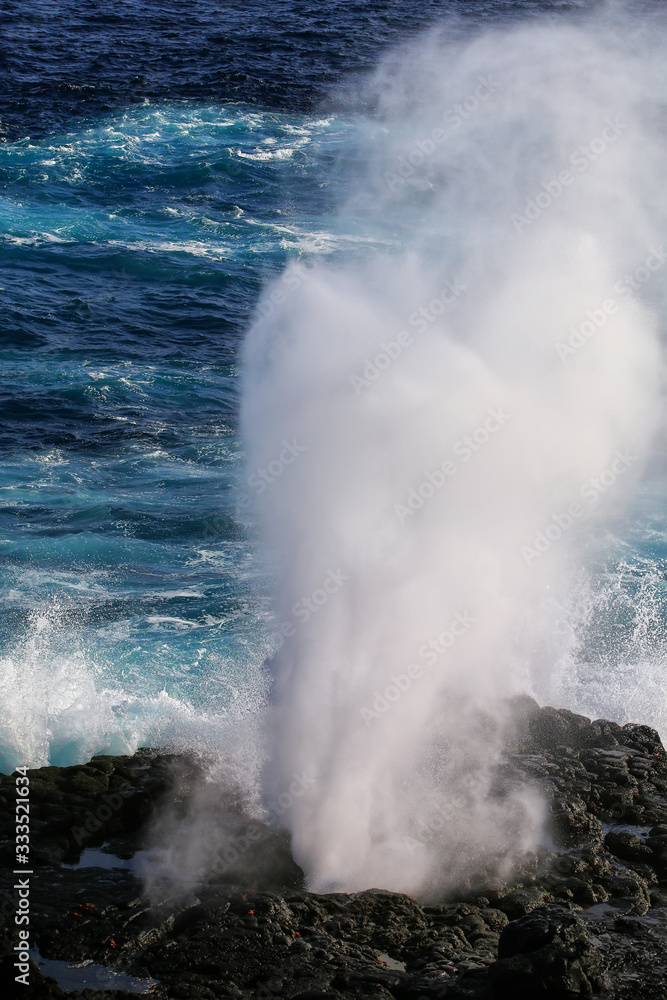 Water bursts through blowhole on Espanola Island, Galapagos National park, Ecuador.