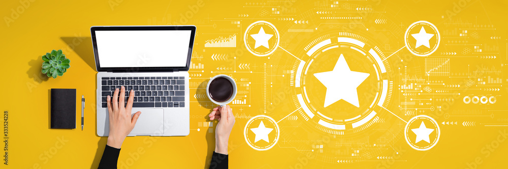 Rating star concept with person using a laptop computer Rating star concept with person using a laptop computer