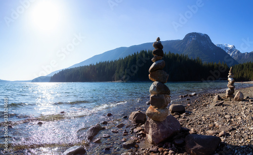 Balancing Rocks on the beach by the Alouette Lake during a sunny winter day. Taken in Golden Ears Provincial Park, near Vancouver, British Columbia, Canada. Panorama Background photo