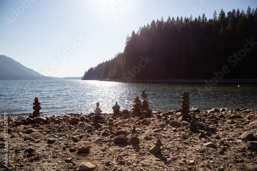 Balancing Rocks on the beach by the Alouette Lake during a sunny winter day. Taken in Golden Ears Provincial Park, near Vancouver, British Columbia, Canada. photo