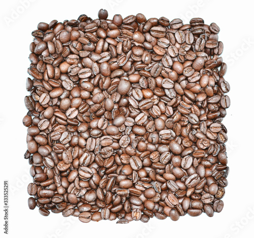Roasted coffee beans texture background or wallpaper. Coffee is a stimulant that contains lots of caffeine and is a tasty drink