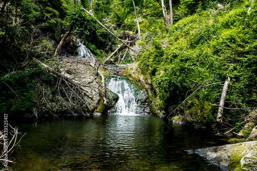 This is a distant view of the small but beautiful waterfall along the Tumbling Waters trail in the Delaware Water gap National Recreation Area in Pennsylvania.