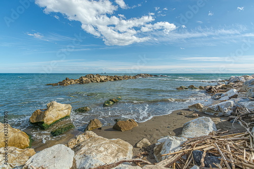 Coastal landscape Breakwater near to beach at Mediterranean Sea. Malaga. Spain. photo