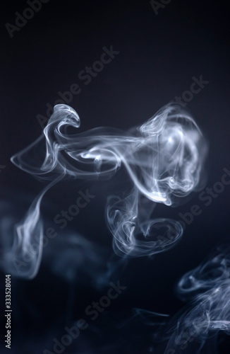 Smoke curves and shapes on dark background