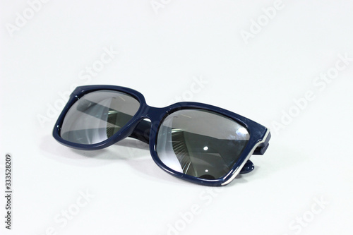 stylish sunglasses with a blue frame on a white background