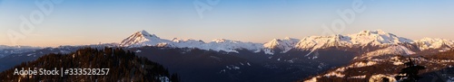Beautiful Aerial Panoramic View of Canadian Mountain Landscape during a colorful sunset. Taken in Squamish, North of Vancouver, British Columbia, Canada. Nature Background Panorama